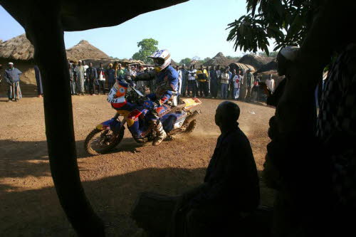 Chris racing through the village Labe - Tambacounda